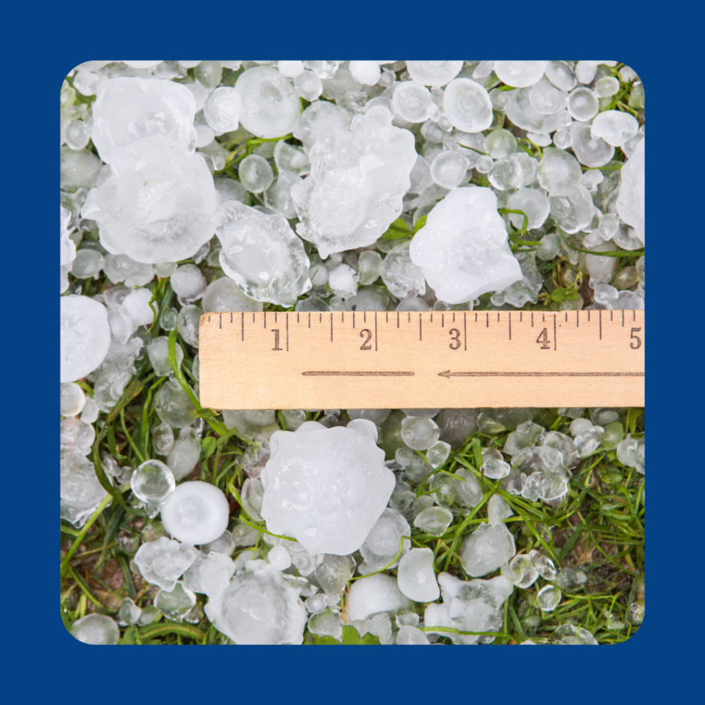 Hail stones next to a ruler to indicate they range in size from one cm to 2 inches
