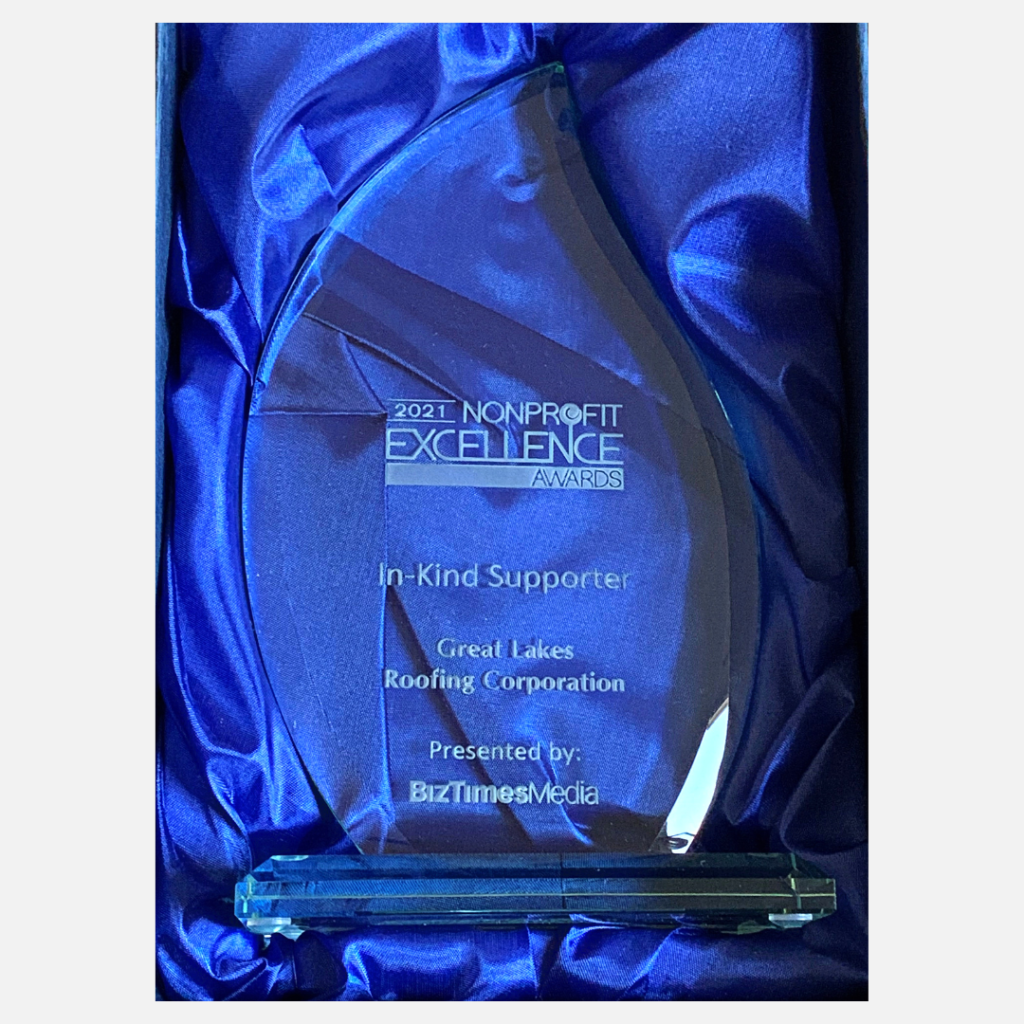 Award we earned with blue satin behind