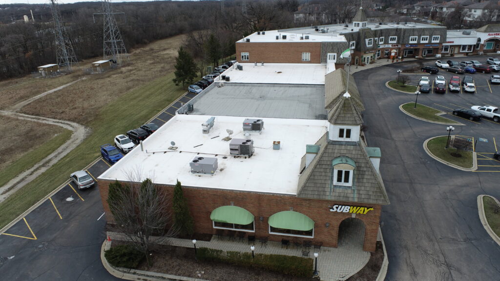 Saratoga Shopping Center, Gurnee, IL, sections of low slope commercial reroof