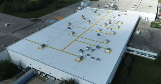 Large manufacturing facility's roof replacement included new yellow safety walkways