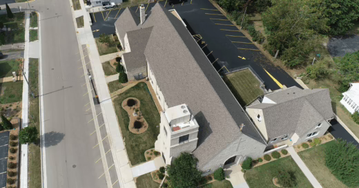 Overhead view of a new shingle roof on a congregation