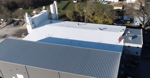 Hortonville manufacturer's metal roof received a single-ply lay-over commercial roofing solution