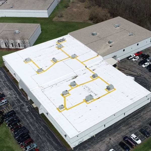 Manufacturing Facility 25 Manufacturing facility over-head view shows yellow safety walkways across the rooftop
